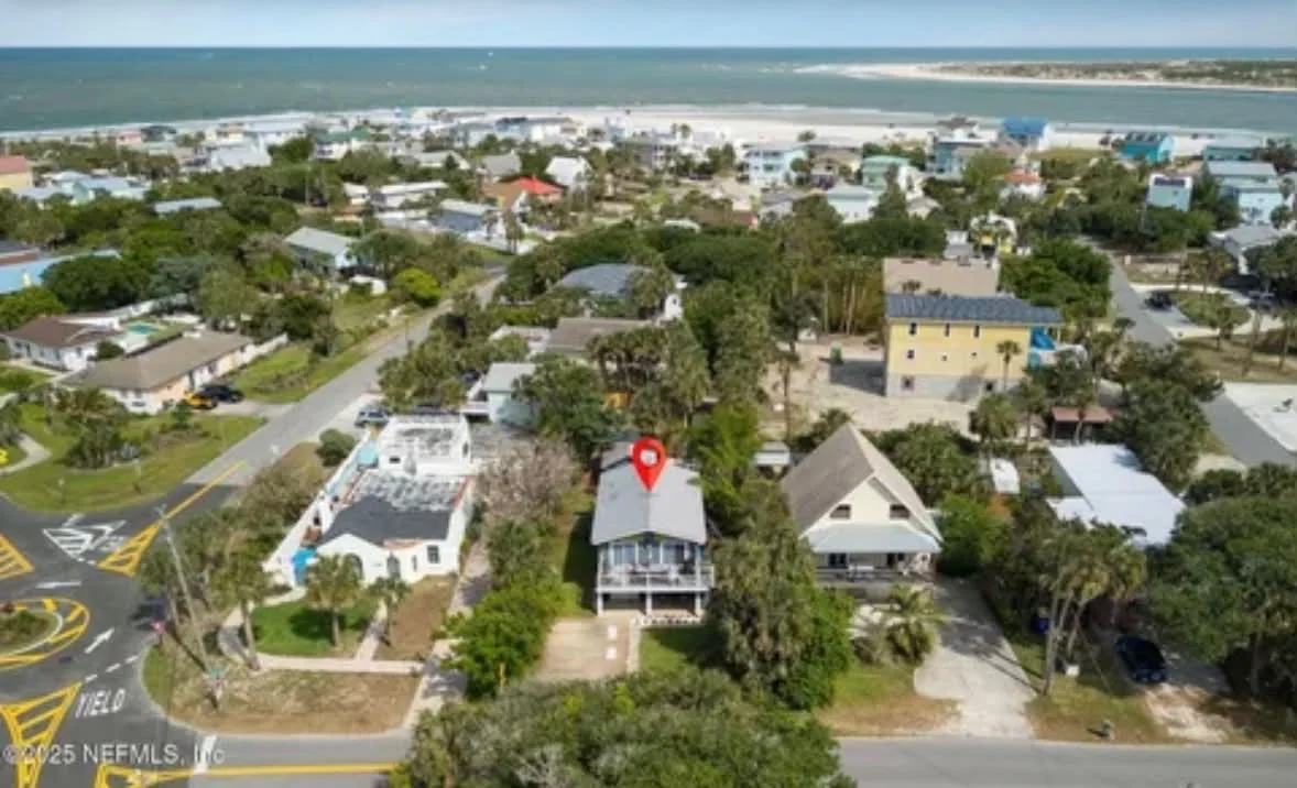 Aerial photograph marking the house with the coast beyond