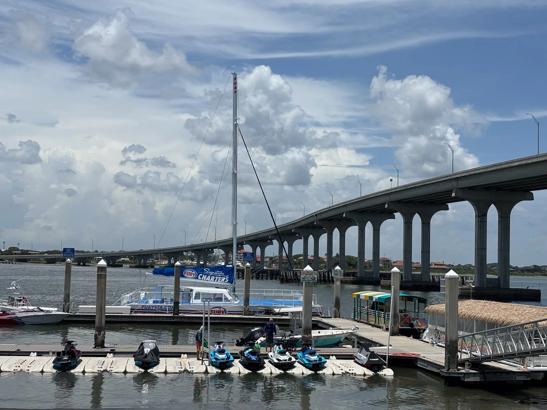 Boats moored beside a bridge at the waterfront