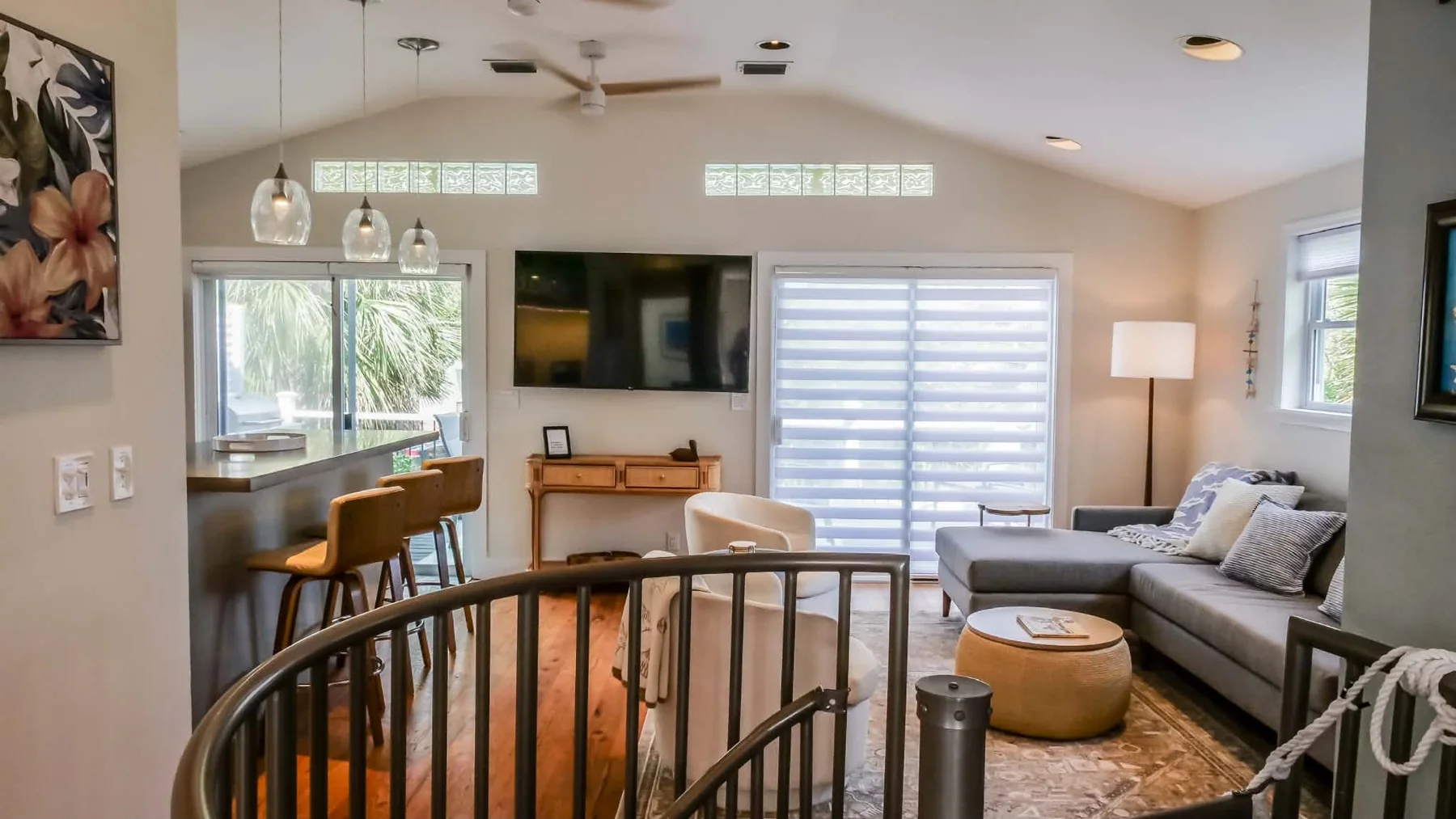 Open-plan living and dining area around the spiral staircase